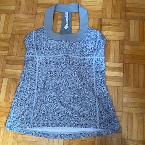 Lululemon athletic top in size 12. Grey and beige floral print.